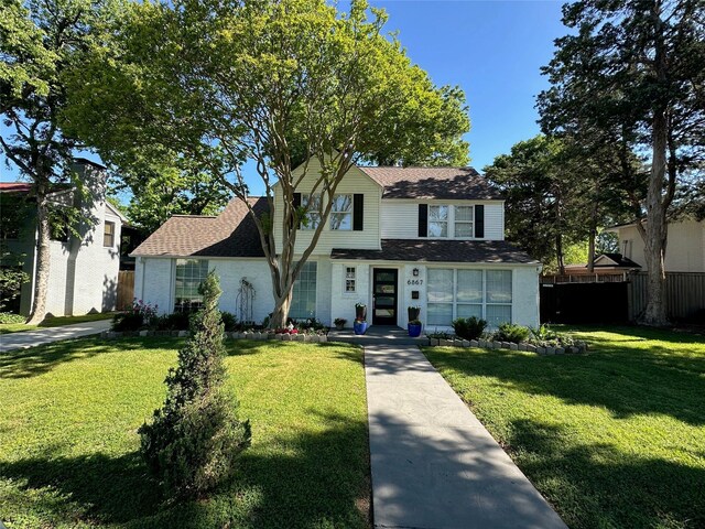 6867 Gaston Ave, Dallas, TX 75214 - view of front of property with roof with shingles, a front yard, and fence