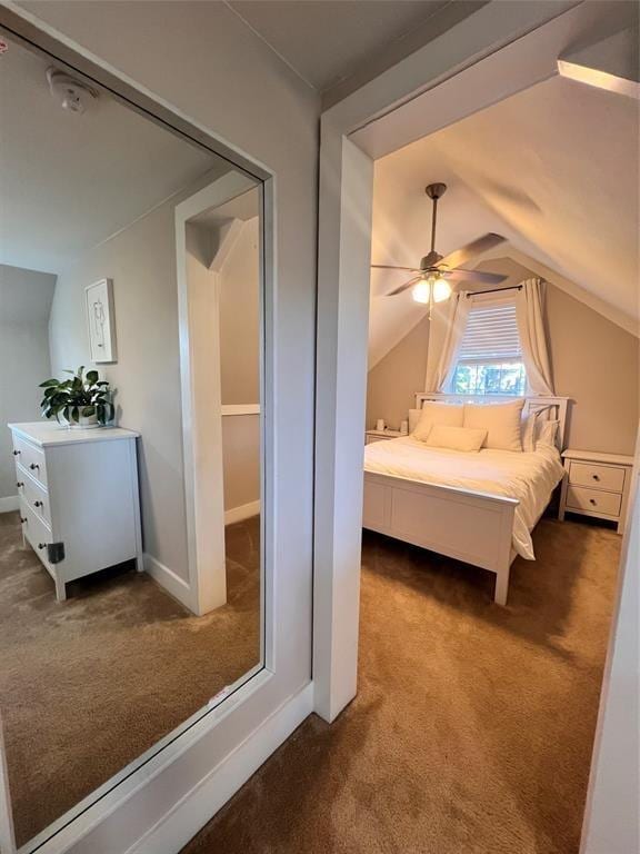 bedroom featuring vaulted ceiling, ceiling fan, and carpet flooring