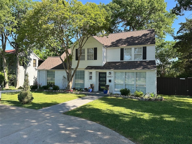 6867 Gaston Ave, Dallas, TX 75214 - view of front of home featuring a front lawn, fence, and a shingled roof