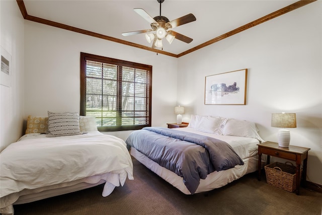 bedroom featuring ornamental molding, carpet flooring, and ceiling fan