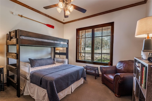 carpeted bedroom featuring crown molding and ceiling fan