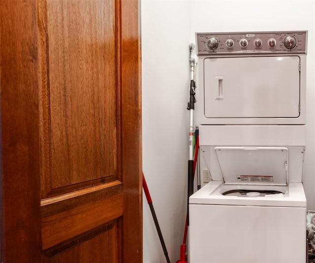 laundry room with stacked washer and clothes dryer