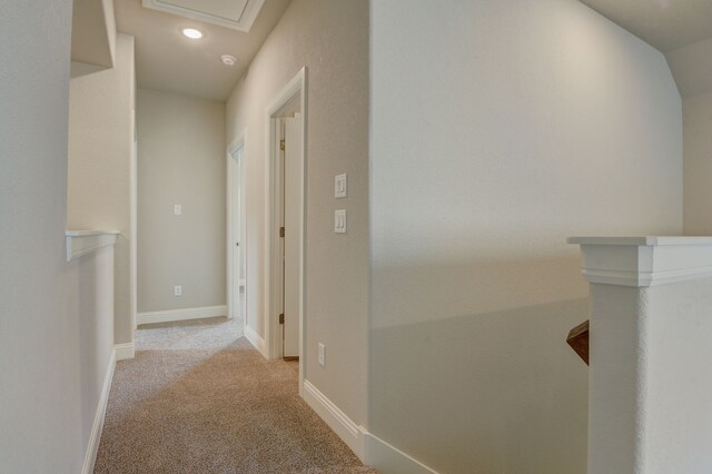 carpeted spare room with vaulted ceiling and ceiling fan