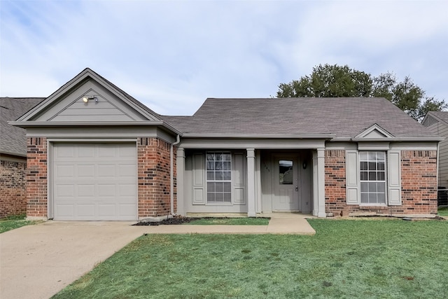 ranch-style home featuring a garage and a front yard