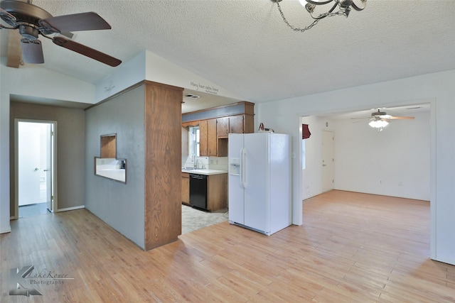 kitchen featuring sink, dishwasher, light hardwood / wood-style floors, and white fridge with ice dispenser