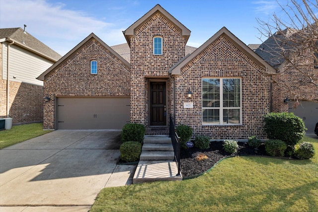 front of property featuring a garage and a front lawn