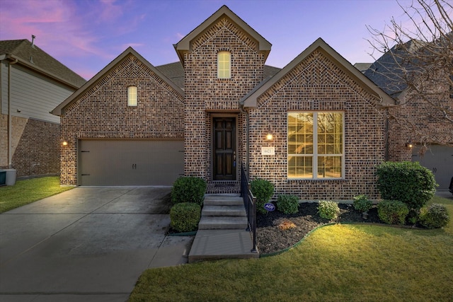 4421 Casa Grande Ln, Mckinney, TX 75070 - view of front of home with brick siding, concrete driveway, a front lawn, roof with shingles, and an attached garage