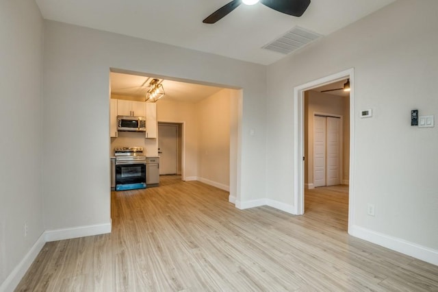 unfurnished living room with light hardwood / wood-style floors and ceiling fan