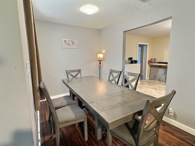 dining room featuring dark hardwood / wood-style floors