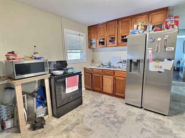 kitchen with sink and appliances with stainless steel finishes