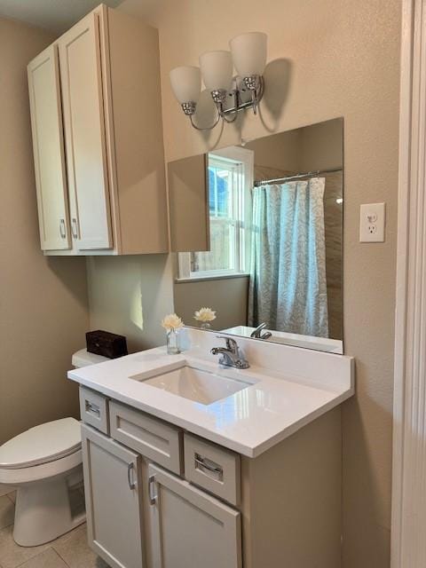 bathroom featuring walk in shower, tile patterned floors, vanity, and toilet