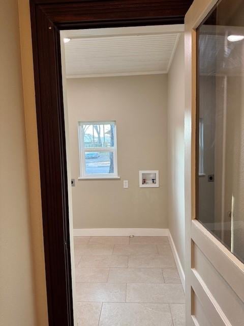 laundry room with hookup for a washing machine and crown molding