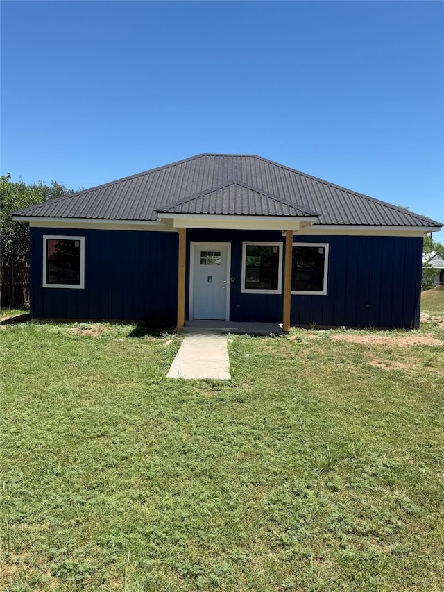 TBD S Cherry St, Merkel, TX 79536 - view of front of house with board and batten siding, a front yard, and metal roof