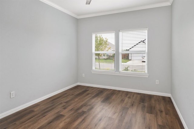 spare room with ceiling fan, ornamental molding, and dark hardwood / wood-style flooring