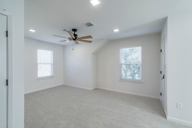 bonus room featuring light carpet and ceiling fan