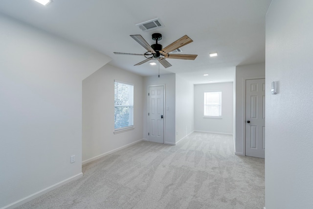 carpeted empty room with ceiling fan