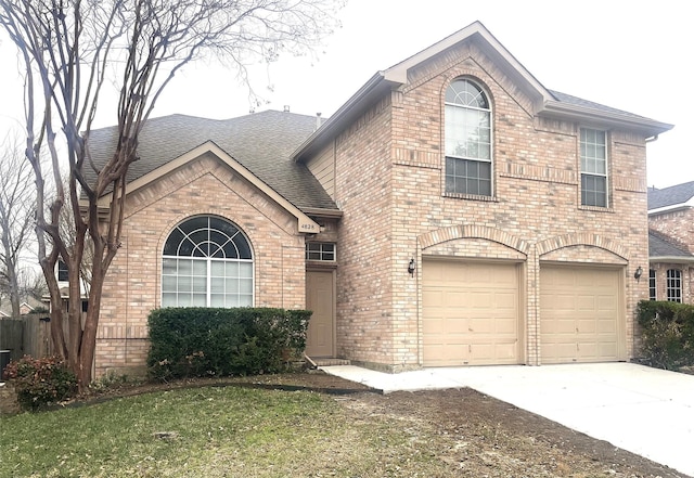 view of front of home with a garage and a front yard