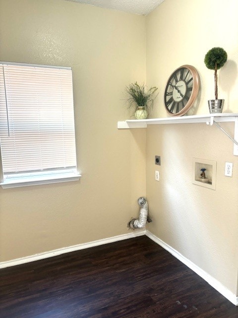 washroom with electric dryer hookup, washer hookup, hardwood / wood-style floors, and a textured ceiling