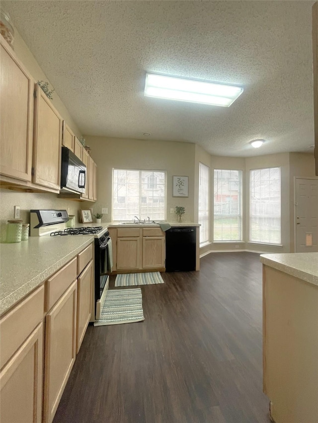 kitchen with sink, dark wood-type flooring, black appliances, a textured ceiling, and light brown cabinets