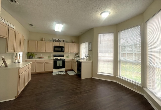 kitchen featuring dark hardwood / wood-style floors, a textured ceiling, light brown cabinets, and black appliances