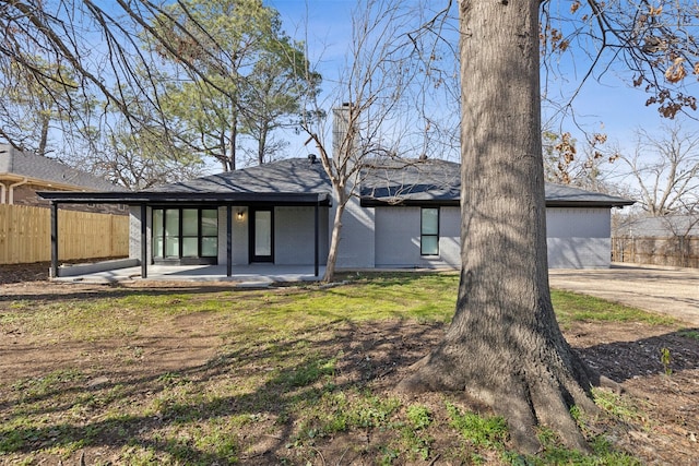 rear view of house with a patio