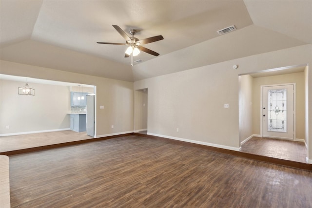 unfurnished living room with lofted ceiling, dark wood-type flooring, a raised ceiling, and ceiling fan