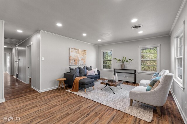 spare room with crown molding, brick wall, and dark hardwood / wood-style flooring