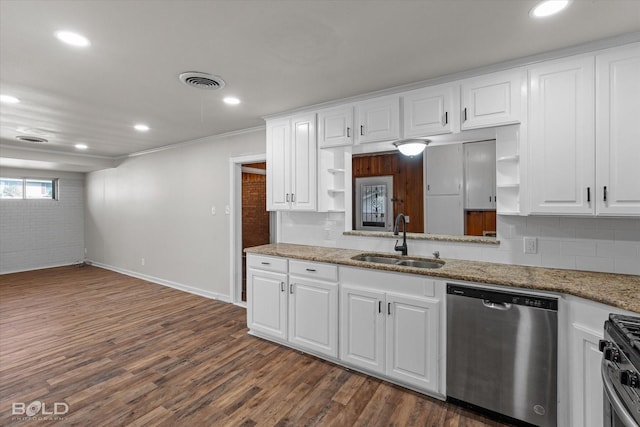 kitchen featuring appliances with stainless steel finishes, white cabinets, a sink, and open shelves