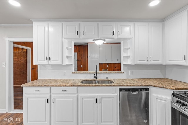 kitchen with open shelves, appliances with stainless steel finishes, a sink, and white cabinetry