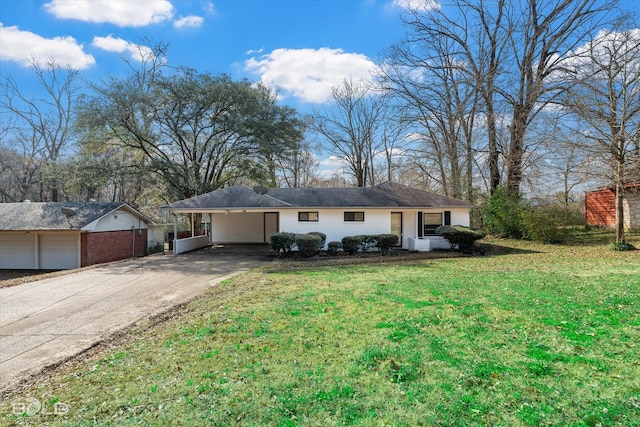 ranch-style house featuring a front lawn, an attached carport, and concrete driveway