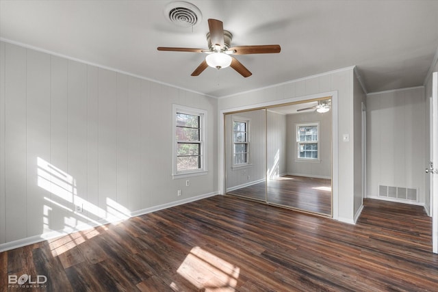 unfurnished room with ceiling fan, ornamental molding, and dark hardwood / wood-style flooring