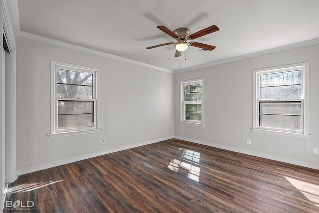 empty room featuring baseboards, dark wood-style flooring, a ceiling fan, and crown molding