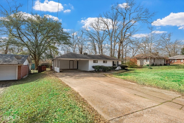 view of front facade with a carport, concrete driveway, and a front lawn