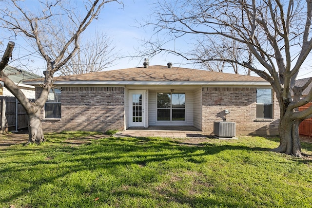 back of property featuring a patio, a yard, and central AC unit