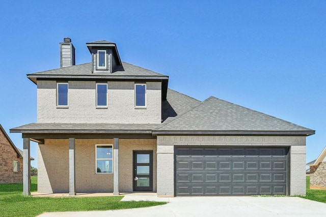 view of front facade featuring a garage and a porch