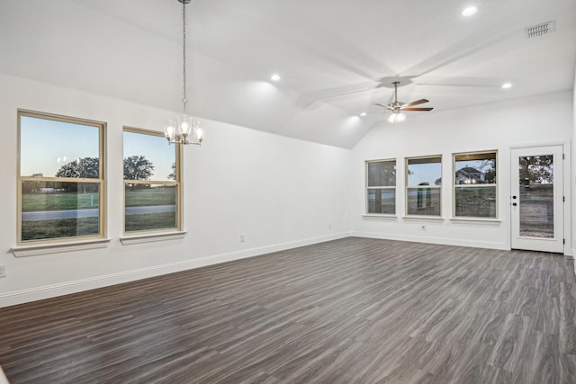 unfurnished living room featuring lofted ceiling, dark hardwood / wood-style flooring, and ceiling fan with notable chandelier