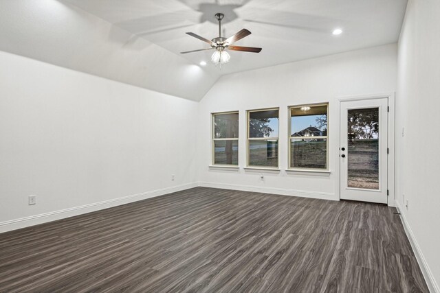 unfurnished room with ceiling fan, dark hardwood / wood-style floors, and vaulted ceiling