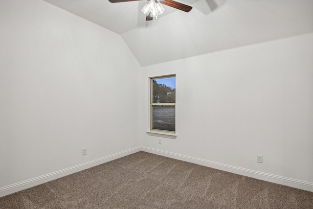 unfurnished room with lofted ceiling, ceiling fan, and carpet