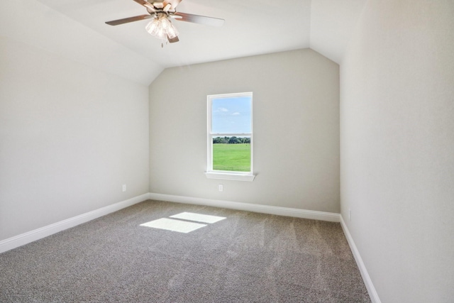 additional living space featuring lofted ceiling, carpet floors, and ceiling fan