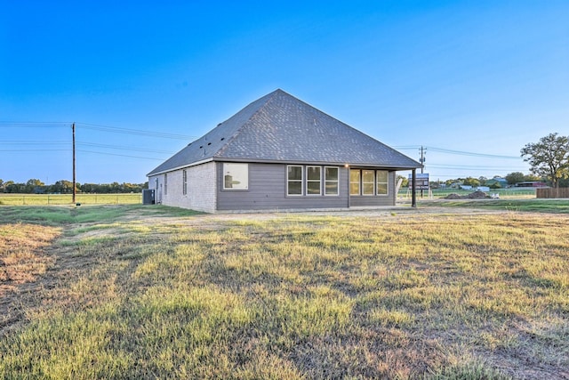 view of property exterior with a yard