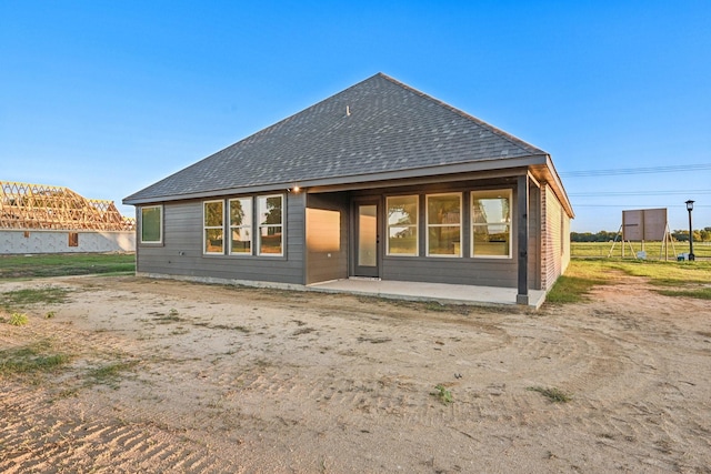 rear view of property with a patio area