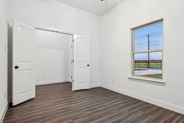 unfurnished bedroom featuring dark hardwood / wood-style floors