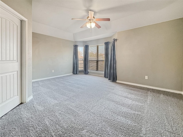 unfurnished room featuring ceiling fan and carpet