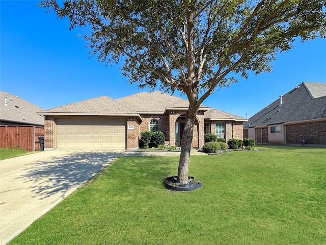 ranch-style house featuring a garage and a front lawn