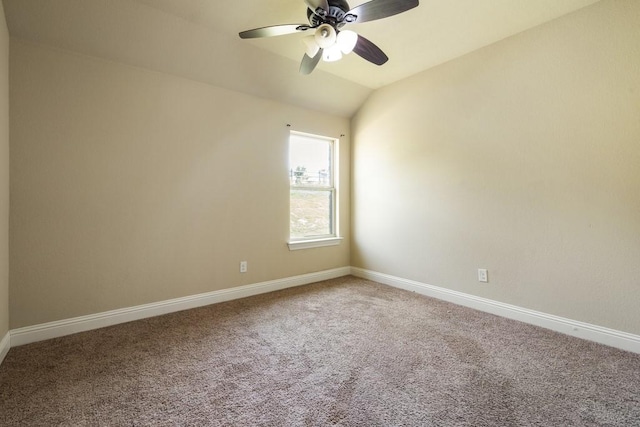 carpeted empty room featuring ceiling fan and lofted ceiling