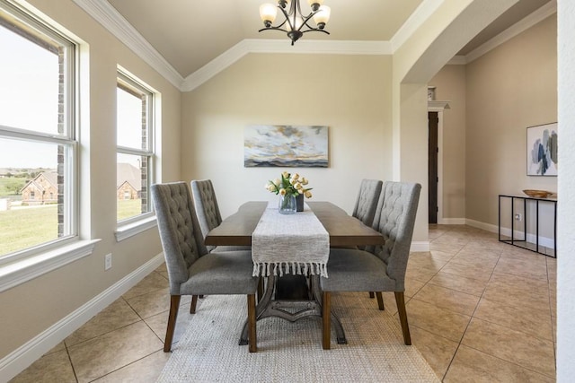 tiled dining room featuring an inviting chandelier, crown molding, and lofted ceiling