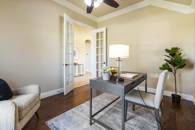 office space with crown molding, ceiling fan, dark hardwood / wood-style flooring, and french doors