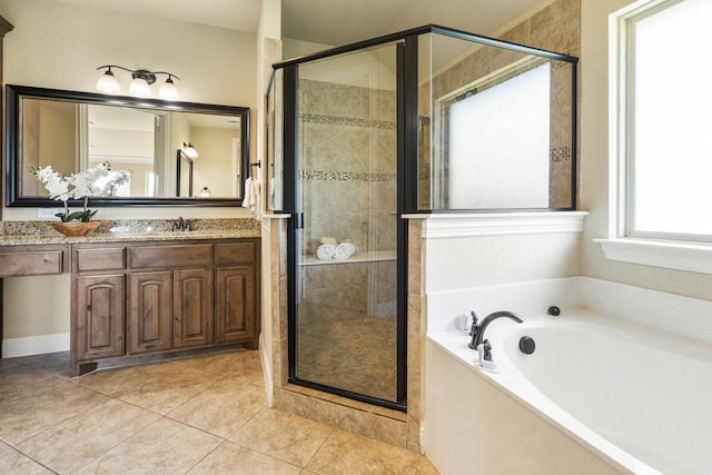 bathroom featuring vanity, shower with separate bathtub, and tile patterned flooring