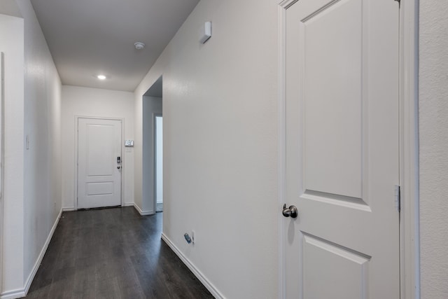 corridor featuring dark hardwood / wood-style flooring