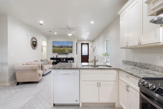 kitchen with white cabinetry, white dishwasher, kitchen peninsula, and sink